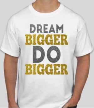 A man wearing a white t-shirt with the words " dream bigger do bigger ".