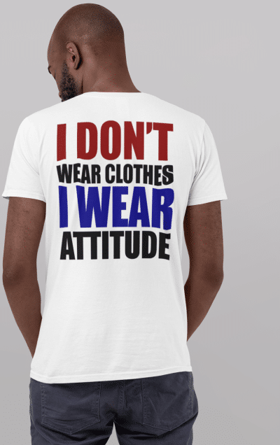 A man wearing a white shirt with the words " i don 't wear clothes, i wear attitude ".