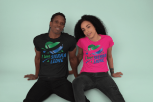 A man and woman sitting on the ground wearing t-shirts.