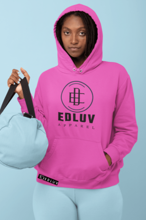 A person holding onto some bags wearing a pink hoodie