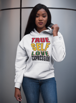 A woman wearing a white hoodie with the words " true self love expression ".