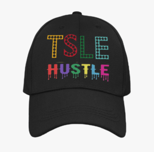 A black hat with the words " tstle hustle ".