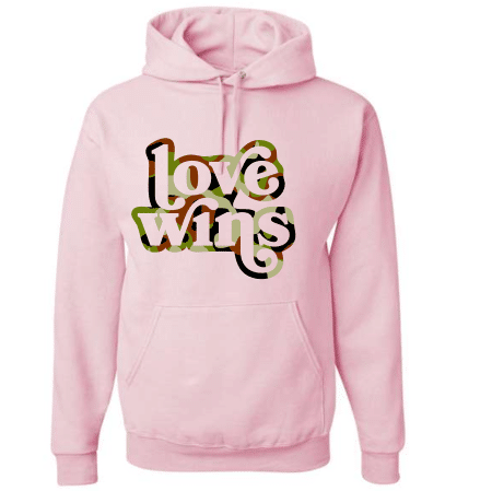 A pink hoodie with the words love wins written in it.