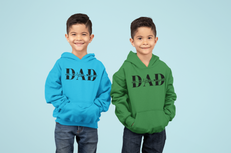 Two boys wearing matching hoodies with the word dad on them.