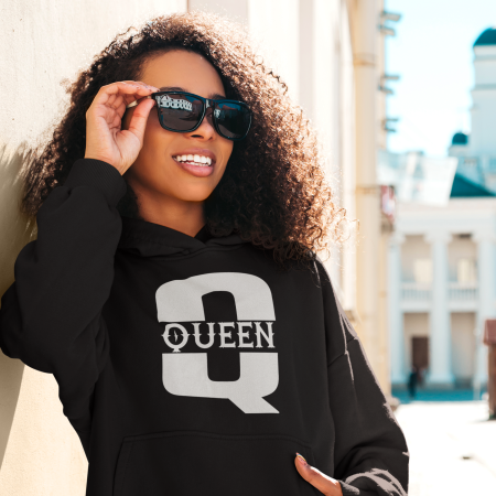 A woman wearing sunglasses and a black hoodie.