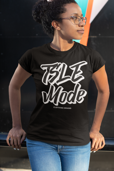 A woman wearing a black t-shirt with the word isle mode written in white.