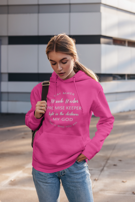 A woman is wearing a pink hoodie