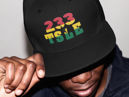 A man wearing a black hat with the number 2 3 3 on it.