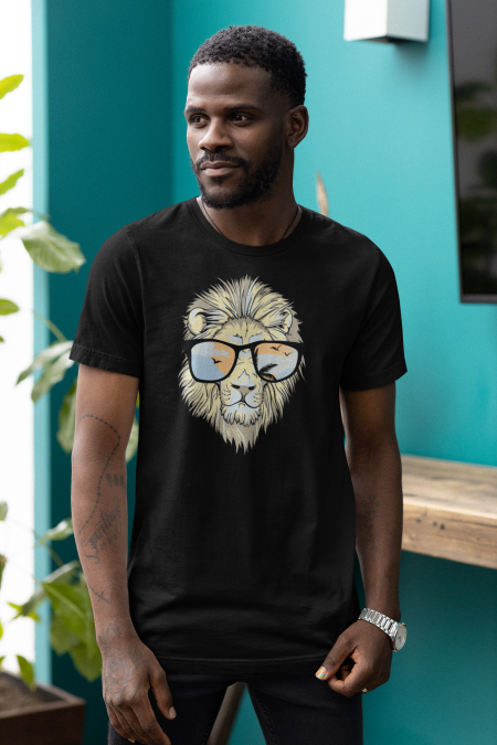 A man wearing glasses and a lion t-shirt.