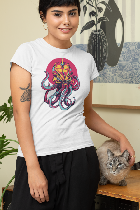 A woman standing next to a cat wearing a t-shirt.